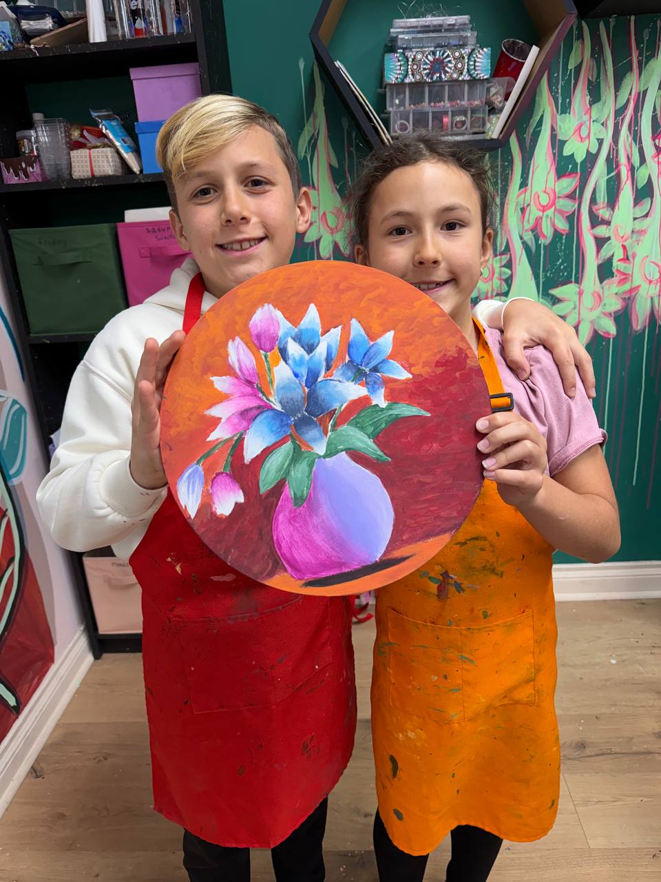 Student with colorful cityscape painting